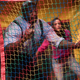 Terry Crews in a bounce house (left), Melissa Fumero in a bounce house